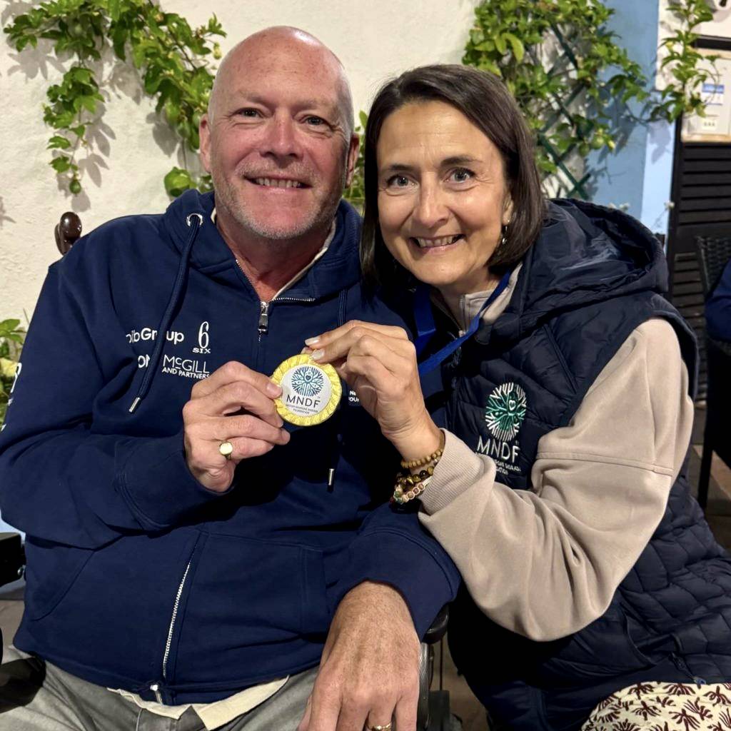 MND Foundation founders Steve Redgwell and Liane Iles smiling together.